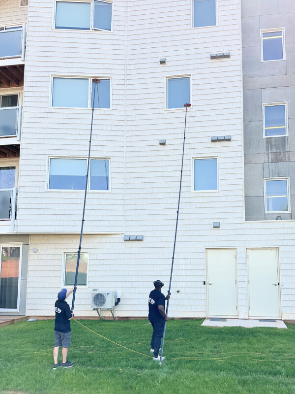 High-reach window cleaning for a Charlottetown condominium complex by Best View Window Cleaning.